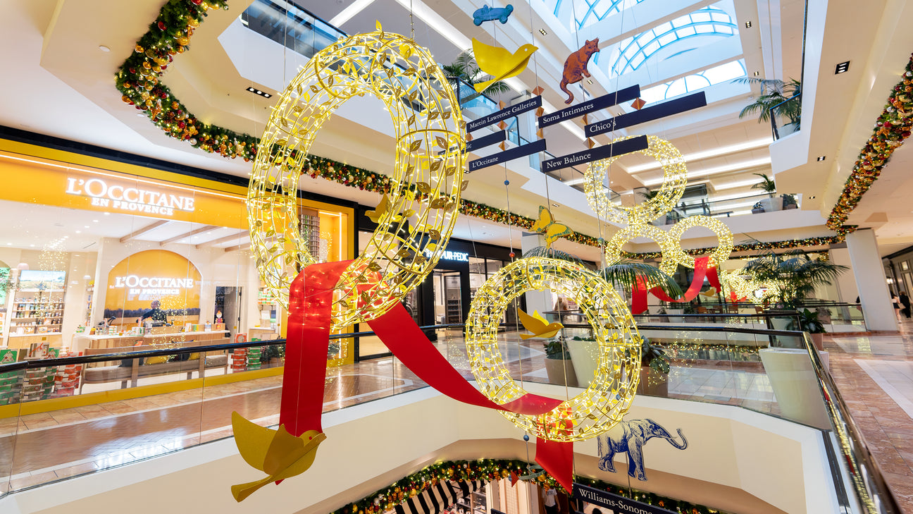 Dekra-Lite holiday decorations filling an atrium with illuminated wreaths